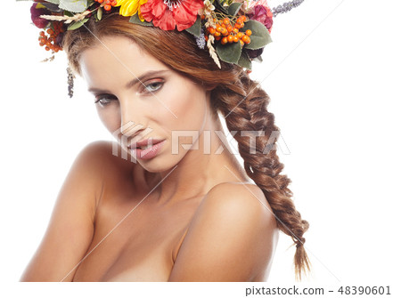 Portrait of a beautiful blonde with a wreath on his head Portrait of a beautiful blonde with a wreath on his head 48390601