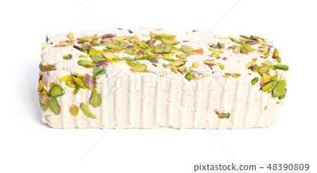 Tahini-based halva with pistachios. Isolated 48390809