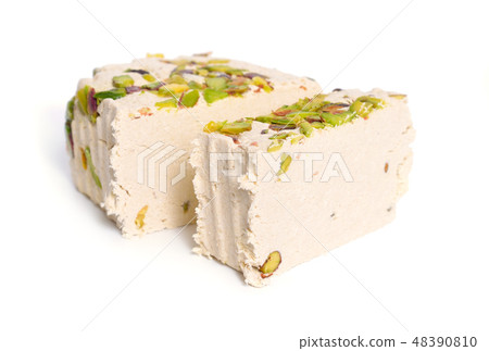 Tahini-based halva with pistachios. Isolated  48390810