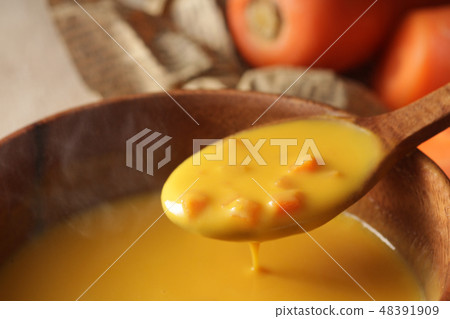 Another warm steaming carrot potage soup 48391909