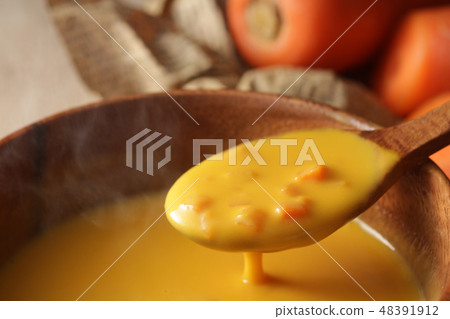 Another warm steaming carrot potage soup 48391912