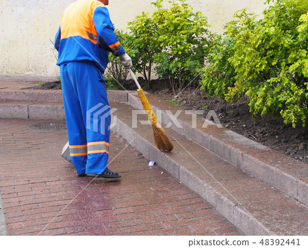 City workers - cleaning and washing of city street 48392441