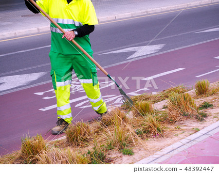 City workers - cleaning and washing of city street 48392447