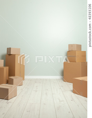 Day moving. Delivery of goods, shopping. Cardboard boxes on gray wall background. Copy space for Day moving. Delivery of goods, shopping. Cardboard boxes on gray wall background. Copy space for 48393106