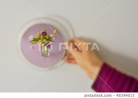 Looking into mirror and seeing Floral Arrangement 48394815