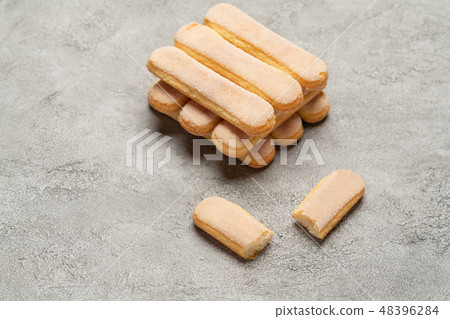 Italian Savoiardi ladyfingers Biscuits on concrete backgound Italian Savoiardi ladyfingers Biscuits on concrete backgound 48396284