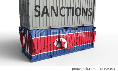 Container with SANCTIONS text breaks cargo container with flag of North Korea. Embargo or political 48396404