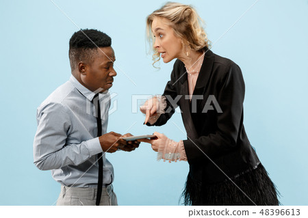Serious businesswoman and colleague in the office. 48396613