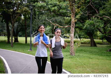 Exercise concept. young women are running inside the park. Beaut 48397243