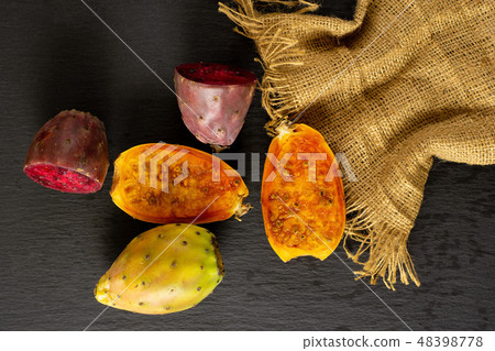 Fresh bright prickly pear opuntia on grey stone 48398778