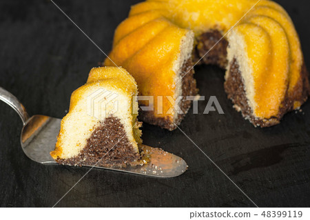 baked marble gugelhupf sweet bread on grey stone baked marble gugelhupf sweet bread on grey stone 48399119