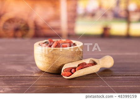 Dried red goji berries with cart 48399159