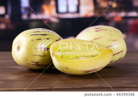 Fresh striped pepino melon with restaurant Fresh striped pepino melon with restaurant 48399386