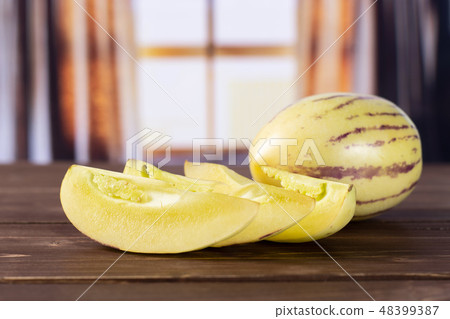 Fresh striped pepino melon with curtains Fresh striped pepino melon with curtains 48399387