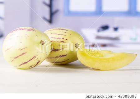 Fresh striped pepino melon with blue window 48399393