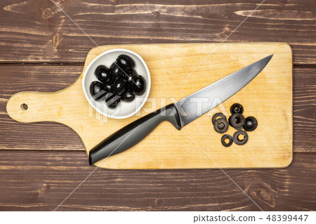 farfalle with arugula leaves on brown wood 48399447