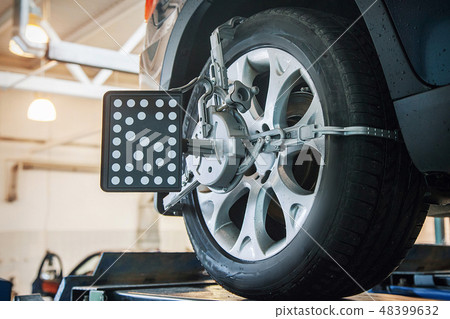 car repair: wheel replacement closeup 48399632