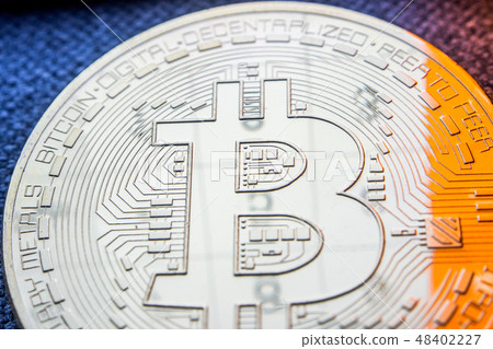 golden bitcoin coin with a numbers reflection  48402227