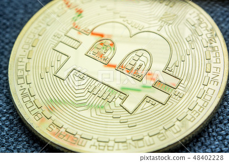 golden bitcoin coin with a chart reflection  48402228
