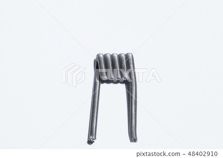Coils for electronic cigarette close-up on a white background. Vape. Coils for electronic cigarette close-up on a white background. Vape. 48402910