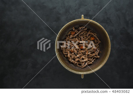 Fried beef in a cauldron. Beef stroganoff. Fried beef in a cauldron. Beef stroganoff. 48403082