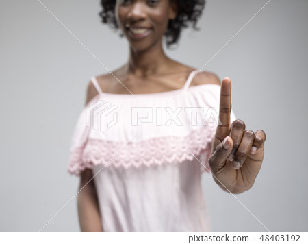 Woman's hand with finger on blue background 48403192