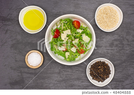 Recipe step by step arugula salad on grey stone Recipe step by step arugula salad on grey stone 48404888