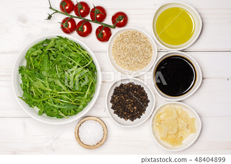 Recipe step by step arugula salad on grey wood Recipe step by step arugula salad on grey wood 48404899
