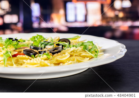 Recipe farfalle with arugula leaves in restaurant Recipe farfalle with arugula leaves in restaurant 48404901