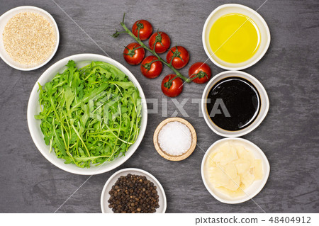 Recipe step by step arugula salad on grey stone Recipe step by step arugula salad on grey stone 48404912