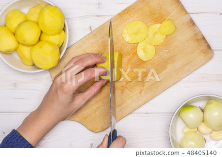 Recipe baked potatoes with onion on grey wood Recipe baked potatoes with onion on grey wood 48405140