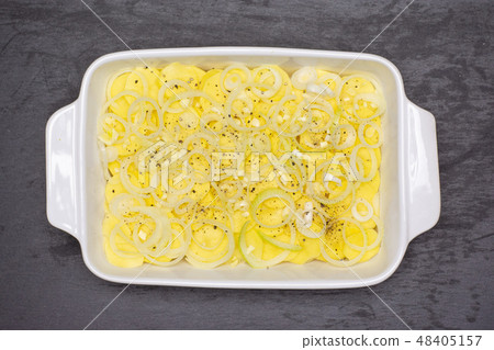 Recipe baked potatoes with onion on grey stone Recipe baked potatoes with onion on grey stone 48405157