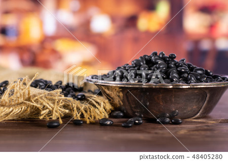 Raw black turtle beans with rustic kitchen Raw black turtle beans with rustic kitchen 48405280