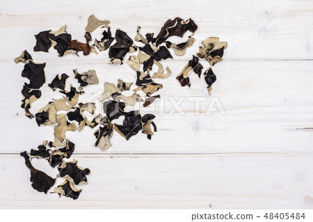 Dry black mushroom jew ear on grey wood Dry black mushroom jew ear on grey wood 48405484