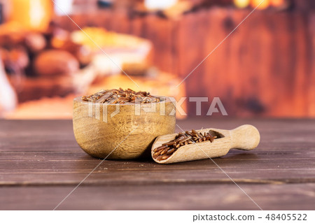 Raw red rice with rustic kitchen 48405522