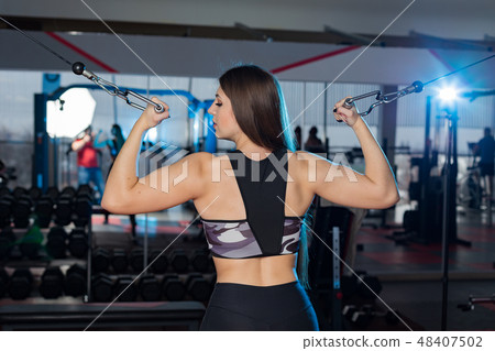 Very beautiful girl trains hands on blocks in the Very beautiful girl trains hands on blocks in the 48407502