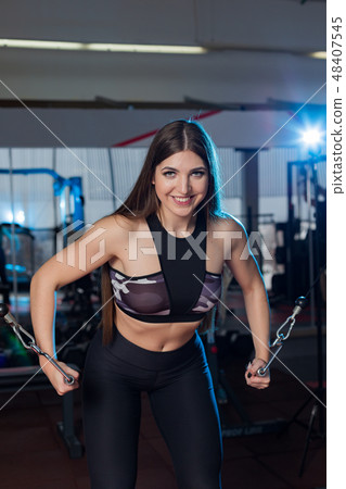 Very beautiful girl trains hands on blocks in the 48407545