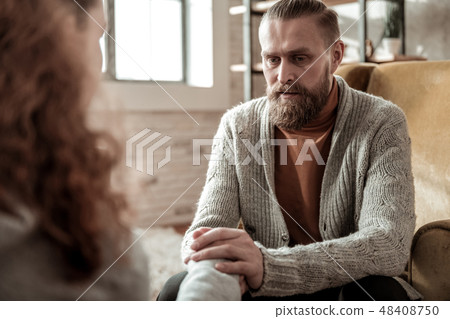 Loving bearded father calming his stressed daughter down 48408750