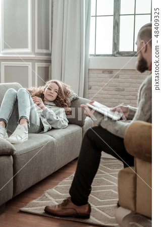 Bearded private therapist listening to girl sharing her thoughts Bearded private therapist listening to girl sharing her thoughts 48409325