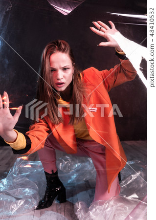 Worried female person posing on camera in studio Worried female person posing on camera in studio 48410532
