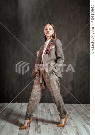 Attractive brunette woman working as model in studio 48410643