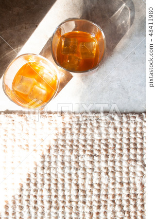 Flat lay glasses of whiskey with ice 48411980