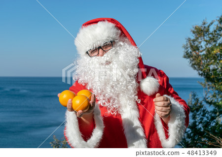Fat man in glasses dressed as Santa Fat man in glasses dressed as Santa 48413349