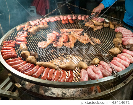 Assorted delicious grilled meat with vegetables ov Assorted delicious grilled meat with vegetables ov 48414671