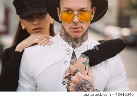 Girl hugging her boyfriend on the street Girl hugging her boyfriend on the street 48416340