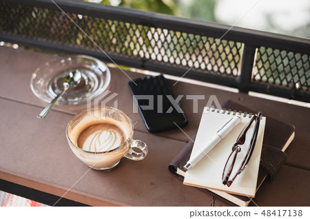 Coffee cup on rustic wood table Coffee cup on rustic wood table 48417138