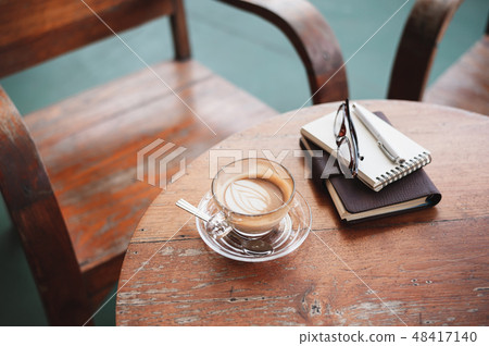 Coffee cup on rustic wood table 48417140
