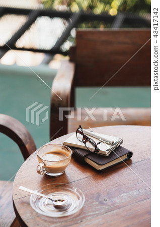 Coffee cup on rustic wood table Coffee cup on rustic wood table 48417142