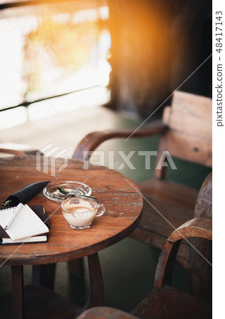 Coffee cup on rustic wood table Coffee cup on rustic wood table 48417143