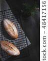 baguette on blue wood table 48417156